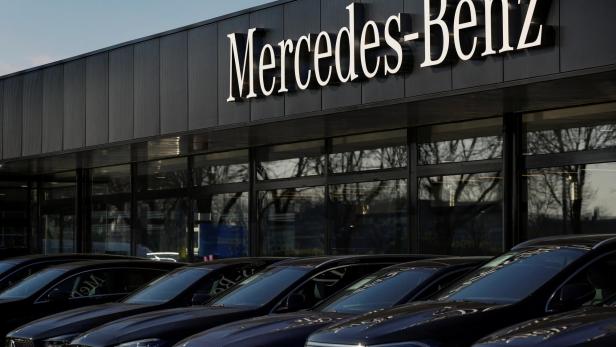 A Mercedes-Benz sign is seen outside a Mercedes-Benz car dealer in Arnhem