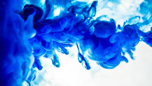 blue ink in water isolated on white background