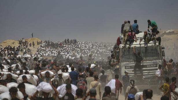 Aid enters Gaza Strip after Israel announces daily pause of hostilities