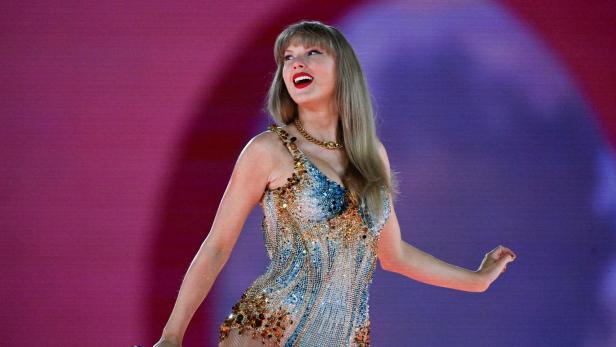 FILE PHOTO: Taylor Swift performs as her record-breaking The Eras Tour comes to an end in Vancouver