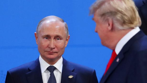 FILE PHOTO: Putin and Trump are pictured in 2018 in Argentina