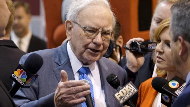 FILE PHOTO: Berkshire Hathaway CEO Warren Buffett talks to reporters prior to the Berkshire annual meeting in Omaha