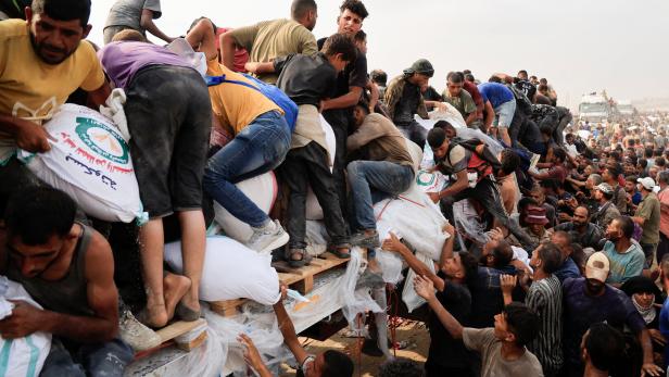 Palestinians seek aid supplies in Khan Younis, southern Gaza Strip