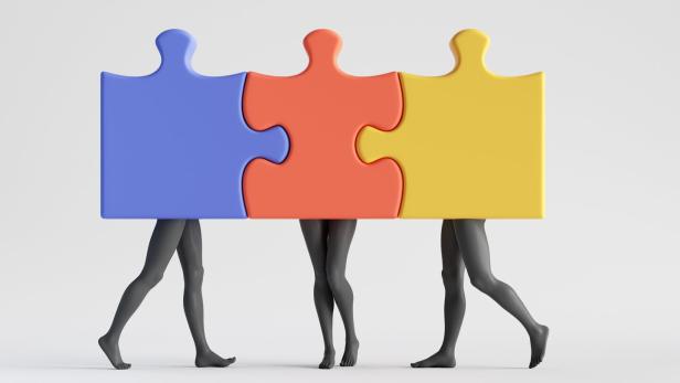 Farbige Puzzleteile mit Mannequinn-Beinen