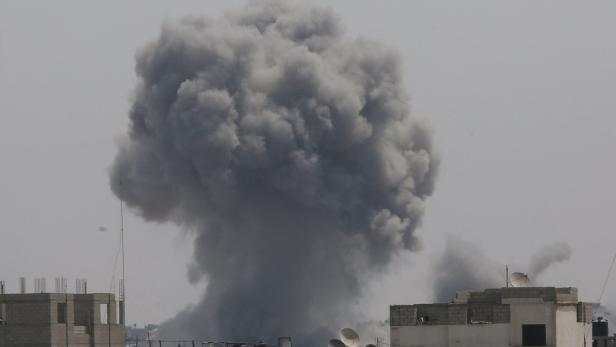 Smoke rises following an Israeli strike, in Khan Younis