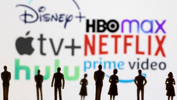 FILE PHOTO: Toy figures of people are seen in front of the displayed Disney +, HBO Max, Apple TV, Netflix, Hulu and Prime logos, in this illustration FILE PHOTO: Toy figures of people are seen in front of the displayed Disney +, HBO Max, Apple TV, Netflix, Hulu and Prime logos, in this illustration
