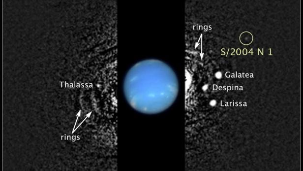 The location of a newly discovered moon, designated S/2004 N 1, orbiting Neptune, is seen in this composite Hubble Space Telescope handout image taken in August 2009. The new moon is the 14th known moon to be circling the distant blue-green planet. REUTERS/NASA/ESA/M. Showalter/SETI Institute/Handout via Reuters (OUTER SPACE - Tags: SCIENCE TECHNOLOGY) THIS IMAGE HAS BEEN SUPPLIED BY A THIRD PARTY. IT IS DISTRIBUTED, EXACTLY AS RECEIVED BY REUTERS, AS A SERVICE TO CLIENTS. FOR EDITORIAL USE ONLY. NOT FOR SALE FOR MARKETING OR ADVERTISING CAMPAIGNS