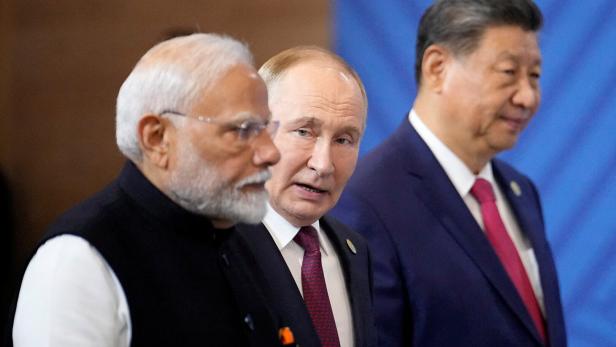 Narendra Modi, Wladimir Putin und Xi Jinping bei einem Treffen.