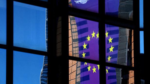 FILE PHOTO: A banner depicting an European Union flag is reflected in a window outside the EU Council headquarters in Brussels FILE PHOTO: A banner depicting an European Union flag is reflected in a window outside the EU Council headquarters in Brussels