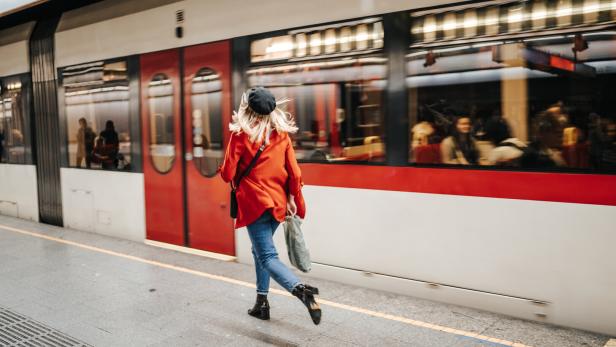 Woman running to catch the train Woman running to catch the train