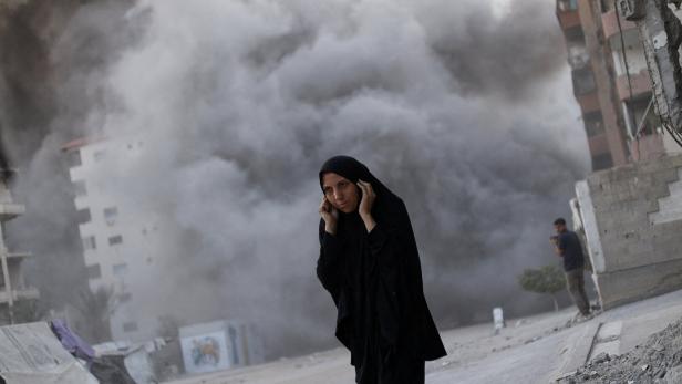 Residential building collapses after an Israeli air strike, in Gaza City Residential building collapses after an Israeli air strike, in Gaza City