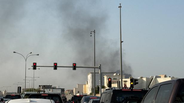 Smoke rises after several blasts were heard in Doha