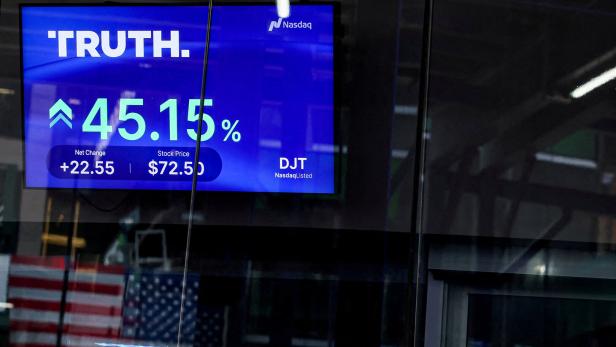 FILE PHOTO: A screen displays trading information about shares of Truth Social and Trump Media & Technology Group, outside the Nasdaq Market site in New York City