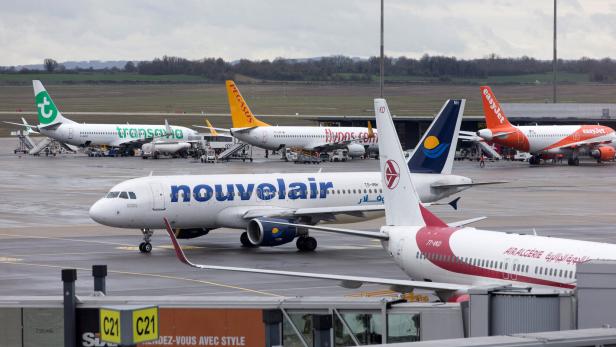 FILE PHOTO: A Nouvelair Airbus A320-214 plane is seen on the tarmac at the Lyon-Saint-Exupery airport in Colombier-Saugnieu near Lyon