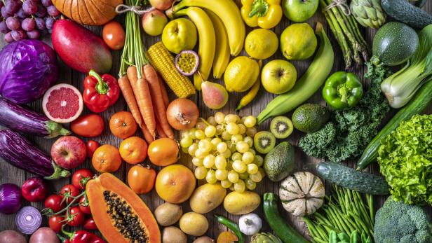 Colorful vegetables and fruits vegan food in rainbow colors