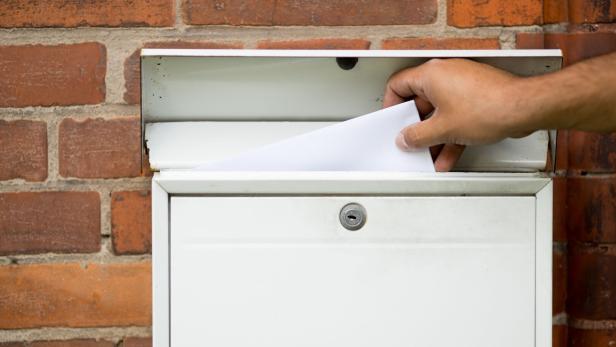 White blank Mailbox on the house wall - letter received