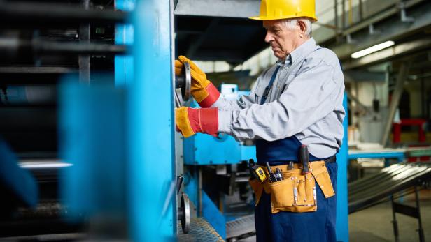 Senior Mechanic Repairing Machine Units at Factory