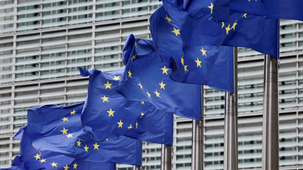 FILE PHOTO: European Union flags flutter outside the EU Commission headquarters in Brussels