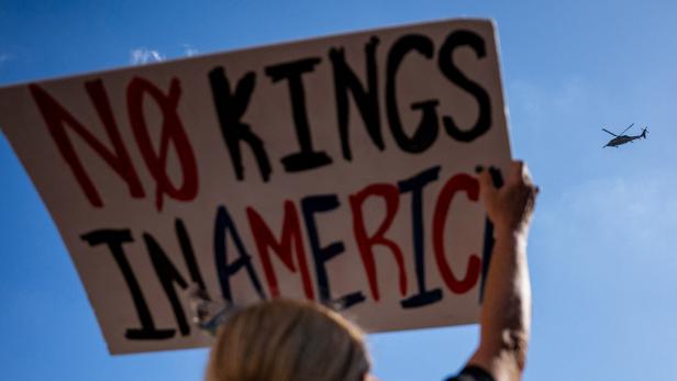 People rally against the deployment of the National Guard and federal agencies in Memphis