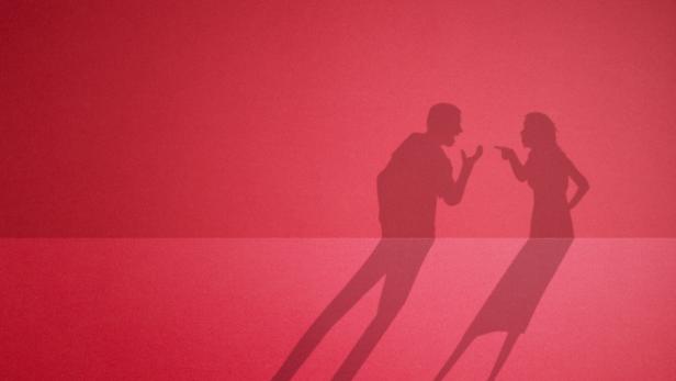 The shadow of a quarreling couple. fight between husband and wife.