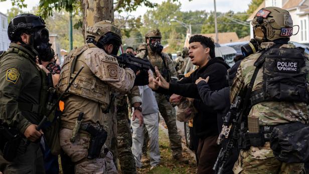 Police clash with community members after detaining a man on Chicago's South Side