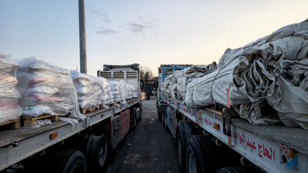 Trucks carrying humanitarian aid and fuel at the Rafah border on the Egypt side