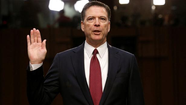 FILE PHOTO: Former FBI Director James Comey is shown in Washington in 2017 FILE PHOTO: Former FBI Director James Comey is shown in Washington in 2017