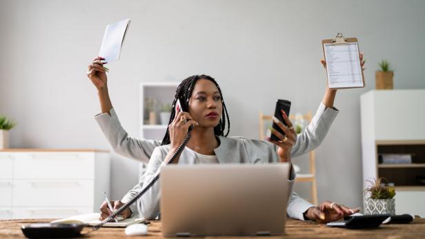 Multitasking Businesswoman In Office Multitasking Businesswoman In Office