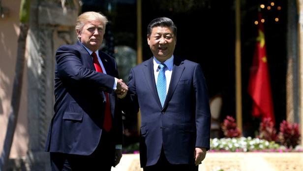 FILE PHOTO: U.S. President Trump and China's President Xi  shake hands during walk at the Mar-a-Lago estate after a bilateral meeting in Palm Beach FILE PHOTO: U.S. President Trump and China's President Xi  shake hands during walk at the Mar-a-Lago estate after a bilateral meeting in Palm Beach