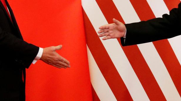 FILE PHOTO: U.S. President Donald Trump and China's President Xi Jinping shake hands FILE PHOTO: U.S. President Donald Trump and China's President Xi Jinping shake hands