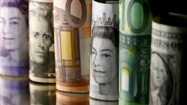 FILE PHOTO: Dollar, Euro and Pound banknotes are seen in this picture illustration FILE PHOTO: Dollar, Euro and Pound banknotes are seen in this picture illustration