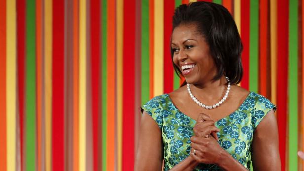 First lady Michelle Obama smiles at the first ever kids "State Dinner" at the White House in Washington