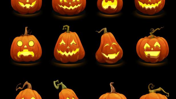 Halloween pumpkins faces glowing in darkness Halloween pumpkins faces glowing in darkness