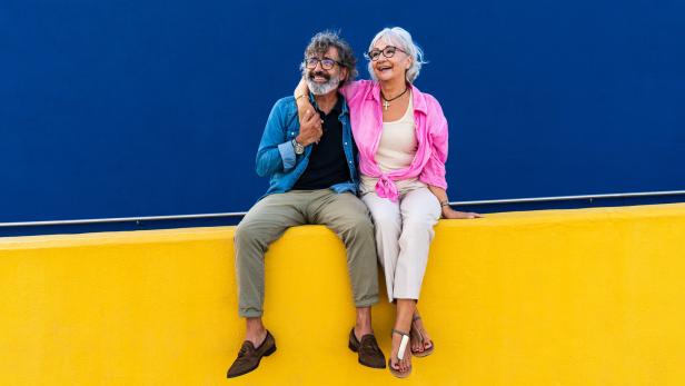 Beautiful happy senior couple bonding outdoors