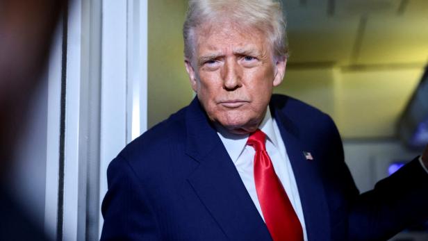 FILE PHOTO: U.S. President Donald Trump speaks to members of the media on board Air Force One en route to the U.S FILE PHOTO: U.S. President Donald Trump speaks to members of the media on board Air Force One en route to the U.S
