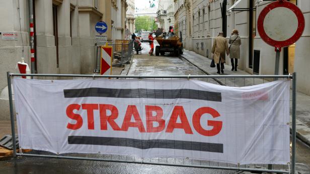 FILE PHOTO: The logo of Austrian construction firm Strabag is seen on the fence blocking a road in Vienna FILE PHOTO: The logo of Austrian construction firm Strabag is seen on the fence blocking a road in Vienna