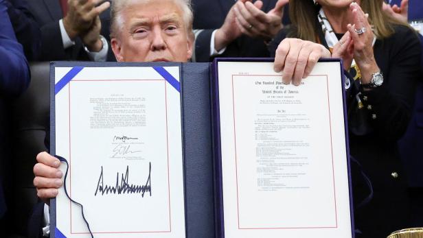 U.S. President Trump signs the funding bill to end the government shutdown, in Washington, D.C.