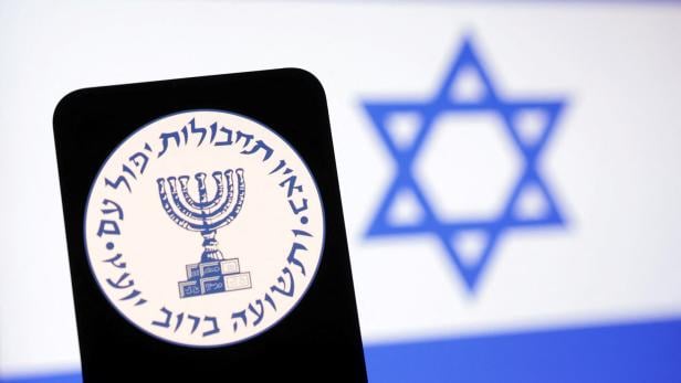 Illustration shows Mossad logo and Israel flag