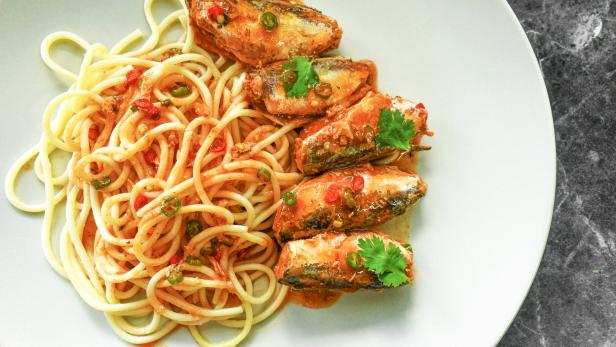 Pasta sardines. Spaghetti with canned sardine with tomato sauce.
