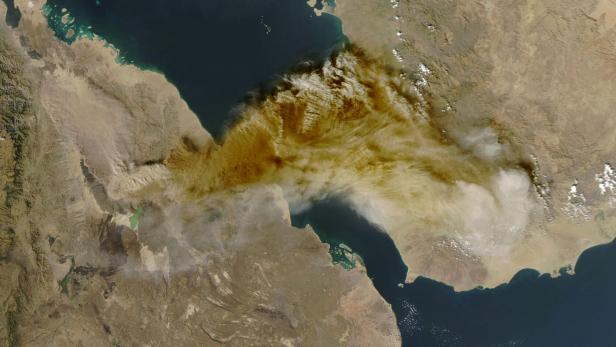 A satellite image shows ash rising from the eruption of the Hayli Gubbi volcano in Ethiopia as it drifts over the Red Sea