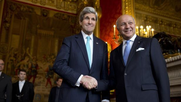 U.S. Secretary of State Kerry shakes hands with Fr