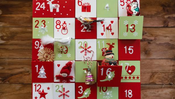 old wooden advent calendar with vintage decoration
