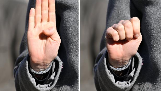 Zeichen mit der Hand