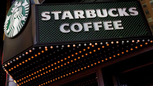 FILE PHOTO: A Starbucks store entrance sign is seen at Times Square in New York City