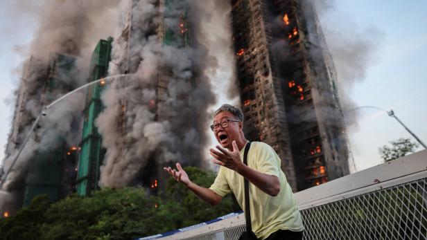 A picture and its story: The photo that became a symbol for Hong Kong's deadly fire