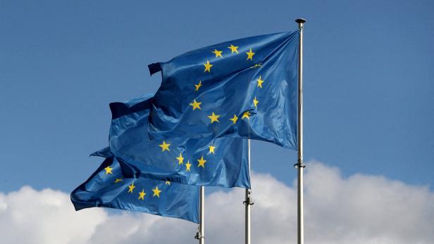 FILE PHOTO: European Union flags fly outside the EU Commission headquarters in Brussels