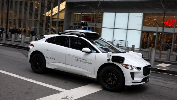 Waymo driverless taxi drives in lower Manhattan in New York