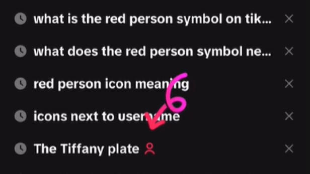 Suchverlauf mit rotem Personensymbol neben einem Suchbegriff auf schwarzem Hintergrund.