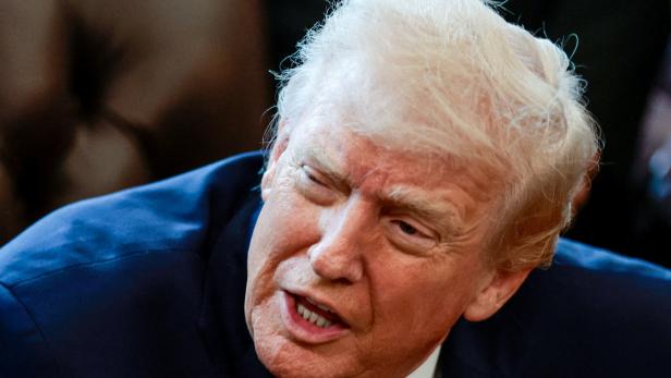FILE PHOTO: U.S. President Trump signs executive orders at the Oval Office, in Washington
