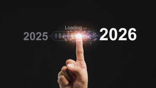 Hand pointing at progress bar loading 2026. Concept of future and technology.